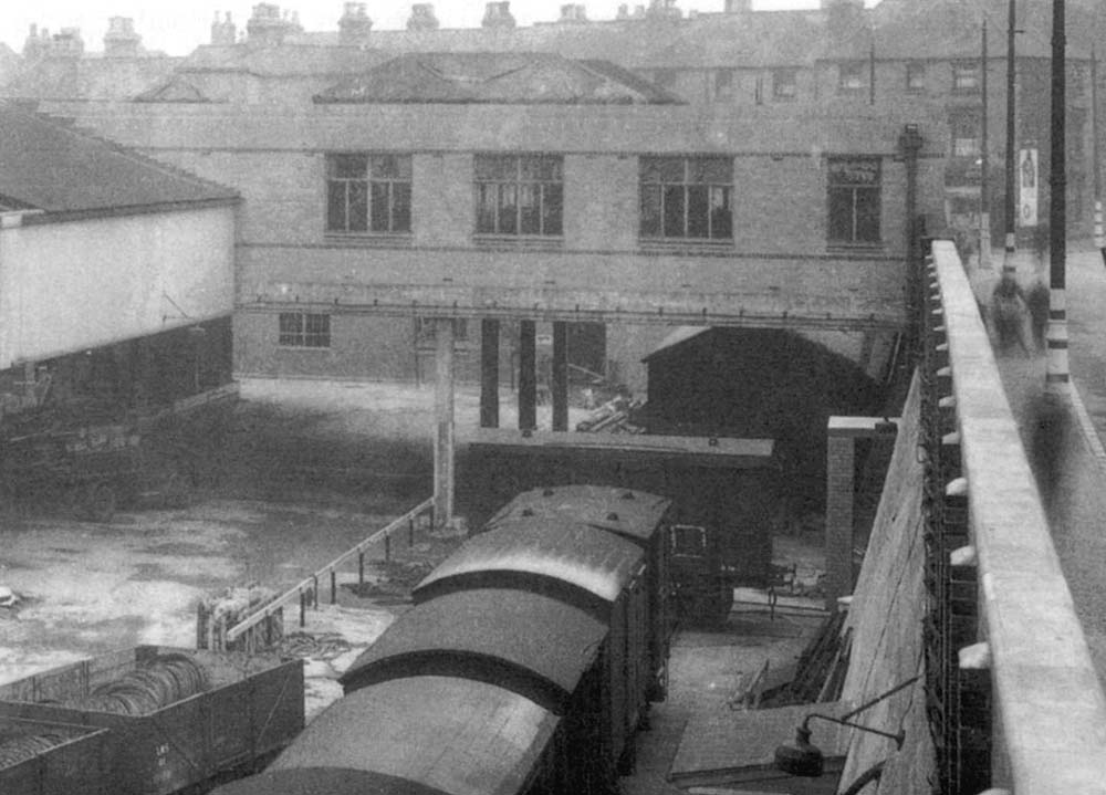 A later view showing the new 'Top' shed now complete and box vans being propelled through to the canal wharf  on 2nd November 1939