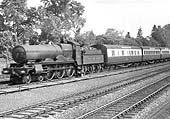 GWR 4-6-0 Saint class No 2983 'Redgauntlet' is seen at the head of a down express train as it approaches Knowle and Dorridge