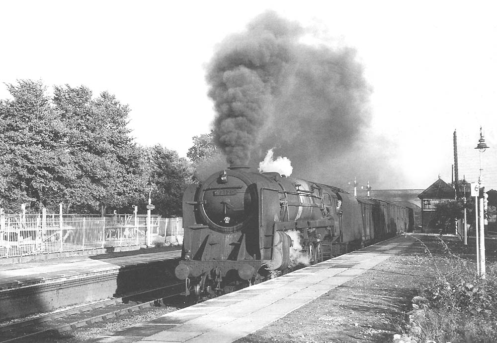 British Railways Standard 9F 2-10-0 No 92120 is seen on a northbound part fitted freight on 14th August 1959