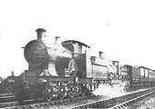 An unknown Achilles class 4-2-2 locomotive doubleheads an outside framed 0-6-0 locomotive on a down fast service circa 1910