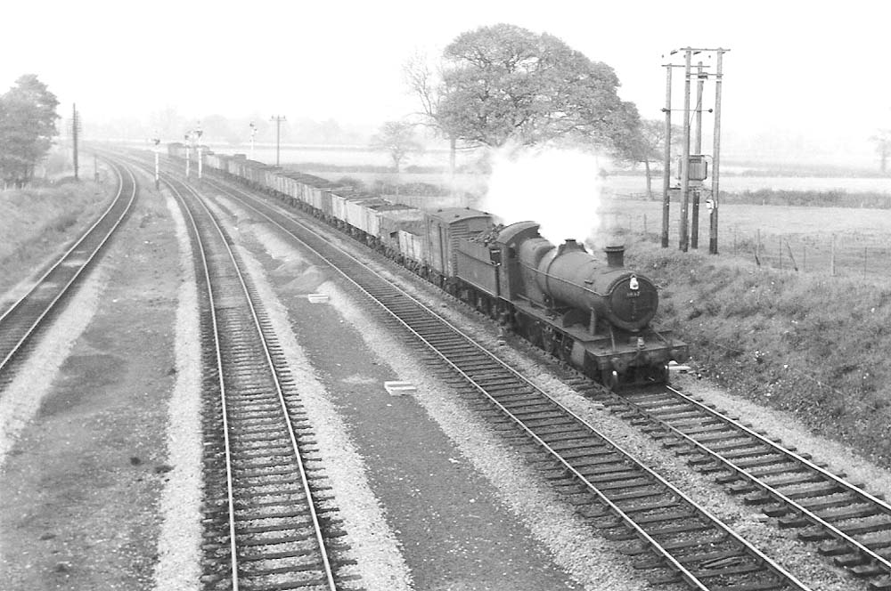 GWR 2-8-0 28xx class No 3837 approaching Lapworth on the Up Main Line with a through freight of mostly mineral open wagons