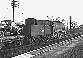 Ex-WD 2-8-0 No 90585 is seen reversing into the relief line to make way for the 4:30pm Wolverhampton to Paddington express service on 3rd March 1957