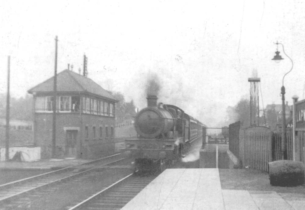 An unidentified GWR 4-6-0 Saint class locomotive is seen passing Lapworth signal box on the 11:15am Wolverhampton to Weymouth express circa 1935