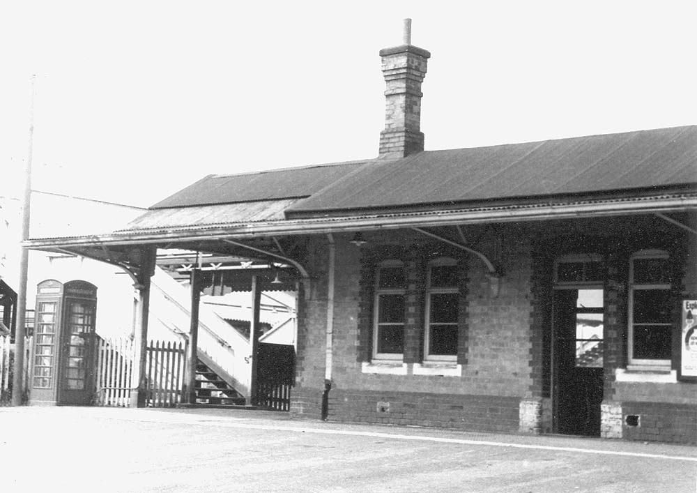 View from Station Road of the left hand side of Lapworth station showing its entrance and footbridge