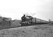 British Railways built 4-6-0 No 7919 'Runter Hall' is seen on a football special near Lapworth on 27th April 1963