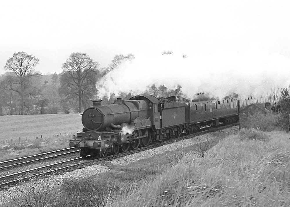 British Railways built 4-6-0 No 7014 'Caerhays Castle' heads a football special near Lapworth on 27th April 1963