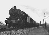 Ex-LMS 2-8-0 8F No 48414 is seen at the head of a Class 7 service near Lapworth on 27th April 1963