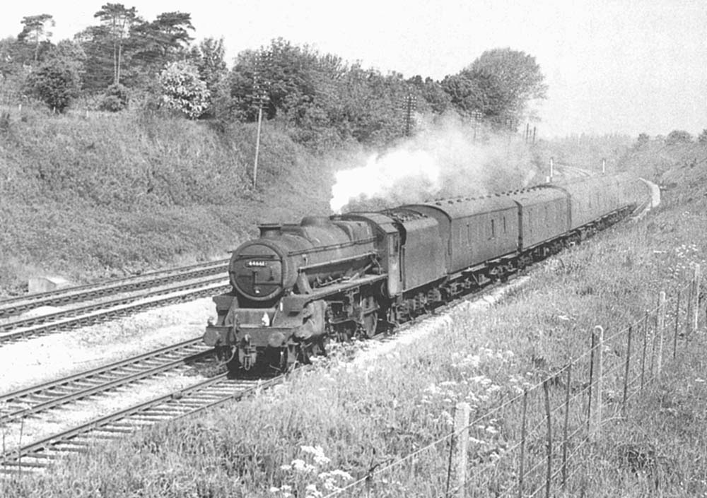 British Railways built 4-6-0 'Black 5' No 44661 is seen heading a south-bound parcels train for Leamington and Banbury on 2nd June 1966