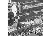 A shunting ground signal also known as a Tommy Dodd, is sited next to Lapworth Signal Box on 2nd December 1961