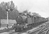 GWR 2-8-2T 72xx class No 7247 is seen entering the station at the head of a short through fast freight train