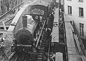 Close up showing a GWR 0-6-0 Deans Goods locomotive standing at the head of an engineer's train