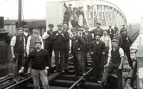 A group of GWR Permanent Way men are seen standing on the bridge after it has been completed