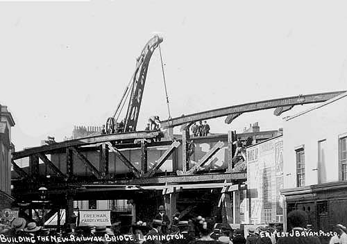 View of the erection of the railway bridge over the junction of High Street and Clement Street, Leamington