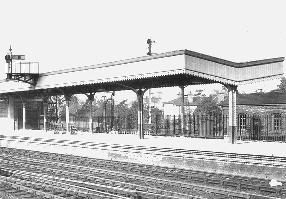Close up showing the London end of the up platform with the Carriage and Wagon department's building behind on the right