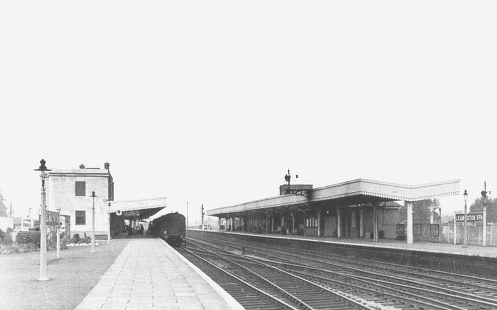 Looking north from the London end of the down platform whilst a passenger train stands adjacent to the main station building