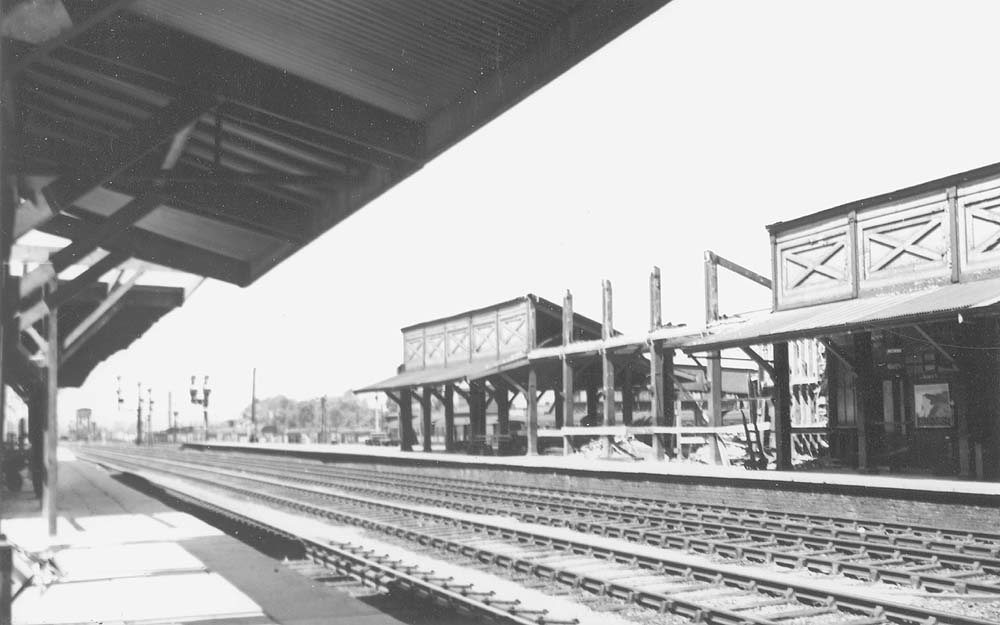 Looking towards the up platform showing the middle section of the train shed being demolished