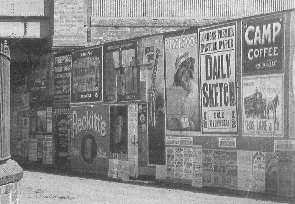 Close up showing a variety of advertising posters displayed on the wall in Lower Avenue