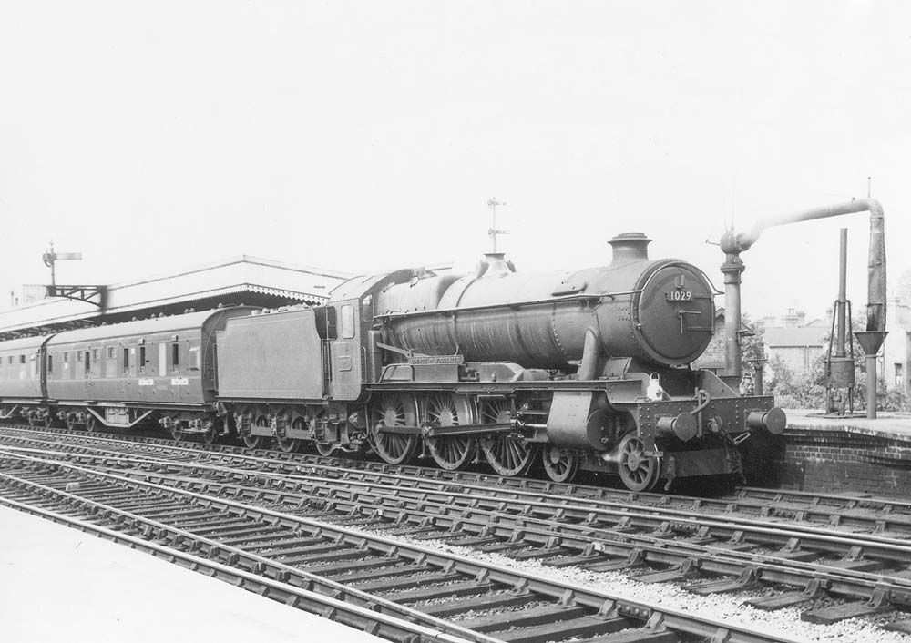 Ex-GWR 4-6-0 County class No 1029 'County of Worcester' pauses at the head of an up express ready for the 'off' signal