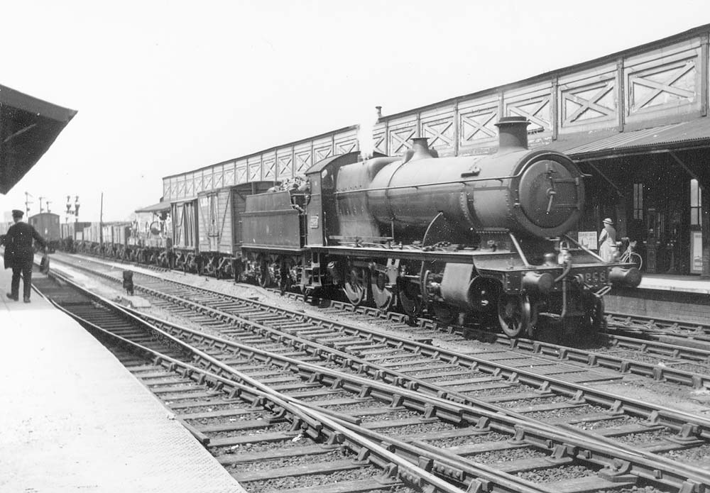 GWR 2-8-0 No 2858 passes through Leamington station on the middle road whilst at the head of an up frieght