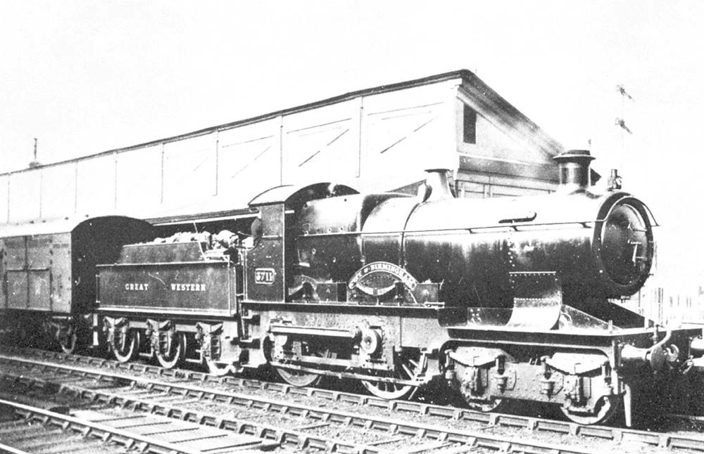 GWR 4-4-0 No 3711 'City of Birmingham' on an up local passenger service with a Horse Box van behind the tender