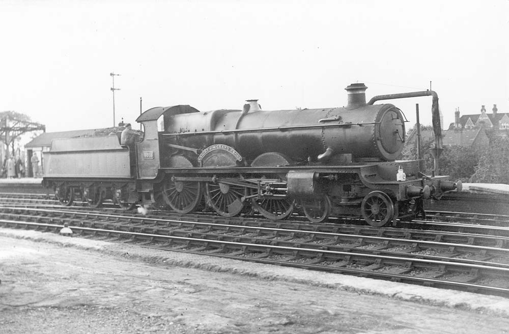 Great Western Railway 4-6-0 No 4018 'Kinght of the Grand Cross' stands light enginge on the middle road