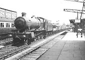 GWR 4-6-0 No 6809 'Burghclere Grange' passes through on a down fast freight service