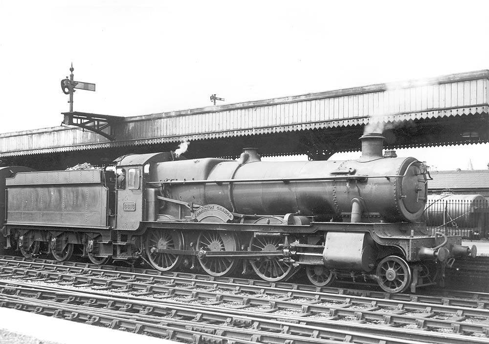 GWR 4-6-0 No 6816 Frankton Grange stands at the up platform heading an express to Paddington circa 1930s