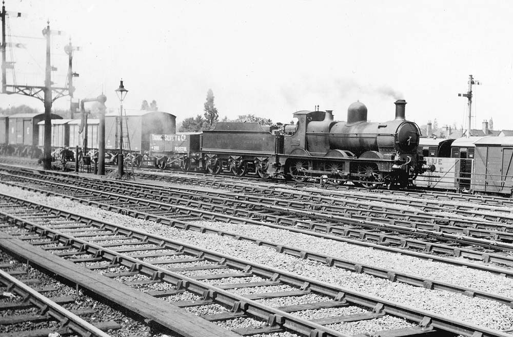 GWR 0-6-0 'Dean goods' No 2465 on an up freight about to pass around the rear of the station via the goods loop