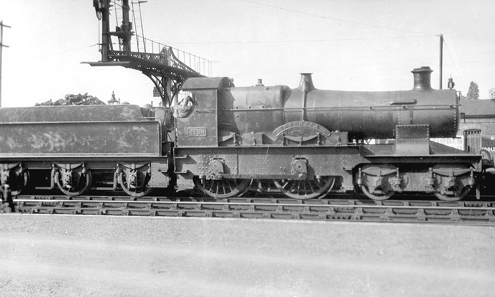GWR 4-4-0 Flower Class No 4158 'Petunia' is seen standing at rest on an up local passenger train to Oxford