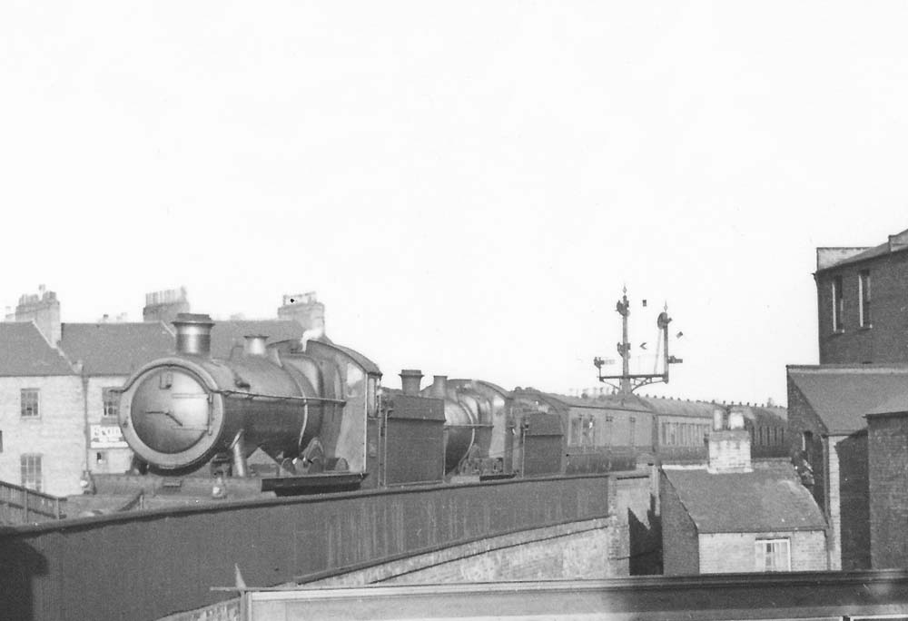 Close up showing an unknown GWR 4-6-0 'Hall' piloting an unknown GWR 4-4-0 'Bulldog' to the southeast of the station