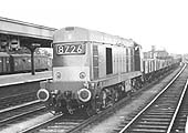 An unidentified English Electric Type 1 diesel locomotive heads an up unfitted freight through Leamington in July 1966