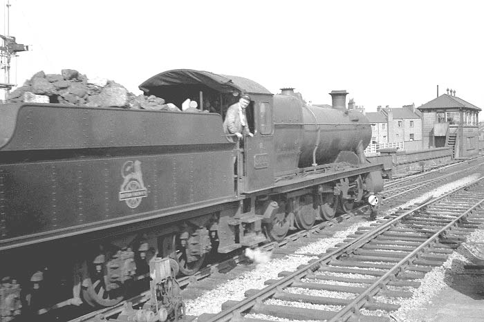 Ex-GWR 2-8-0 28xx Class No 2899 is seen approaching Leamington South Signal Box whilst at the head of an up goods train