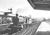 Ex-GWR 43xx Class 2-6-0 No 5390 trundles through the station with a down iron-ore train on 8th September 1957