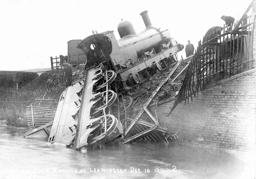 GWR 388 Class 0-6-0 No 497 is seen derailed with its tender lying partly in the canal on 16th December 1911
