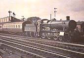 GWR 49xx Class 4-6-0 No 4916 'Crumlin Hall' stands at the up platform on a Snow Hill to London service in 1935