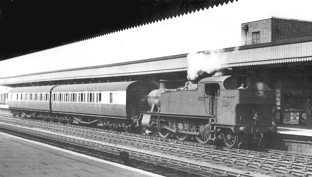 Ex-GWR 5101 Class 2-6-2T No 5104 stands at Leamington's up platform with an up local service