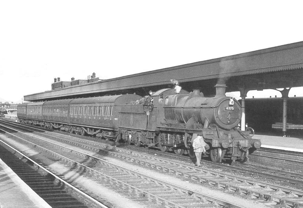 Ex-GWR 43xx Class 2-6-0 No 4375 stands at Leamington's down platform with a local passenger service for Snow Hill in June 1957