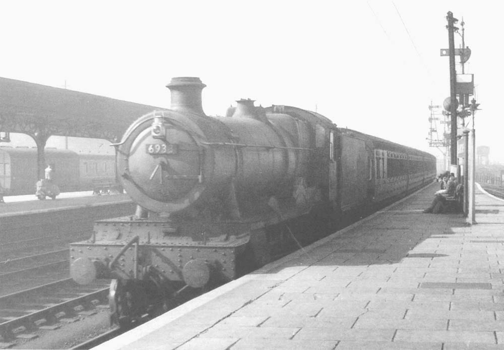 Ex-GWR 4-6-0 49xx Class No 6933 'Birtles Hall' is seen entering Leamington station with a four coach local train in the  early 1950s