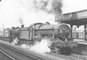 Ex-GWR 49xx Class 4-6-0 No 5938 'Stanley Hall' pilots an unidentified 28xx Class locomotive through Leamington