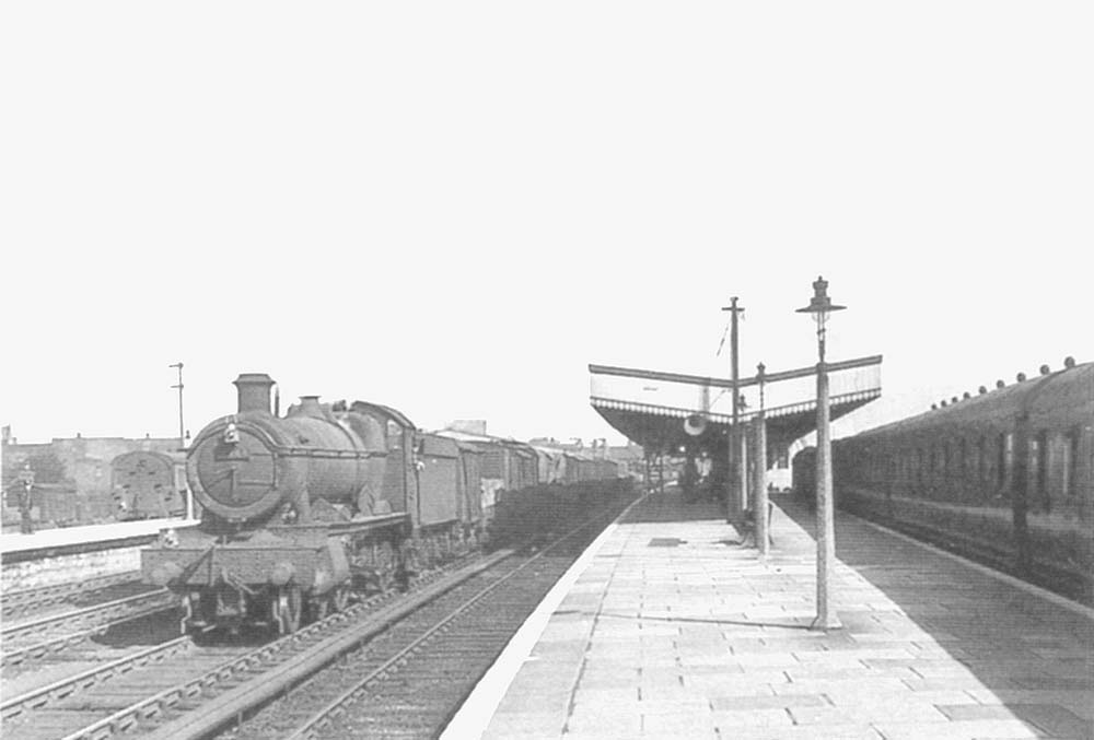 Ex-GWR 49xx Class 4-6-0 No 4943 'Marrington Hall' passes through on the down centre road during the early 1950s