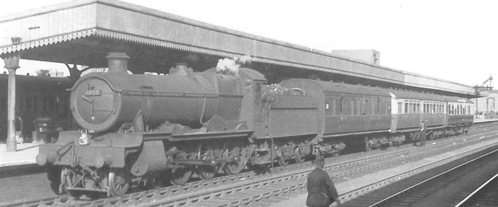 Ex-GWR 68xx Class 4-6-0 No 6858 'Woolston Grange' faces Birmingham with a motley collection of coaching stock
