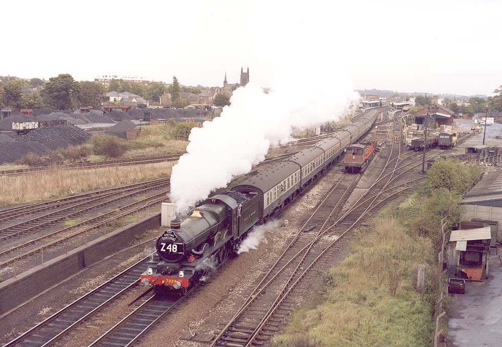 British Railways built 4073 Class 4-6-0 No 7029 'Clun Castle' is seen working hard on 'The Dinting Venturer' circa 1980