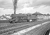 Ex-LMS 2-8-0 8F No 48620 runs light engine ready from Leamington shed on to former LNWR metals on 11th April 1965