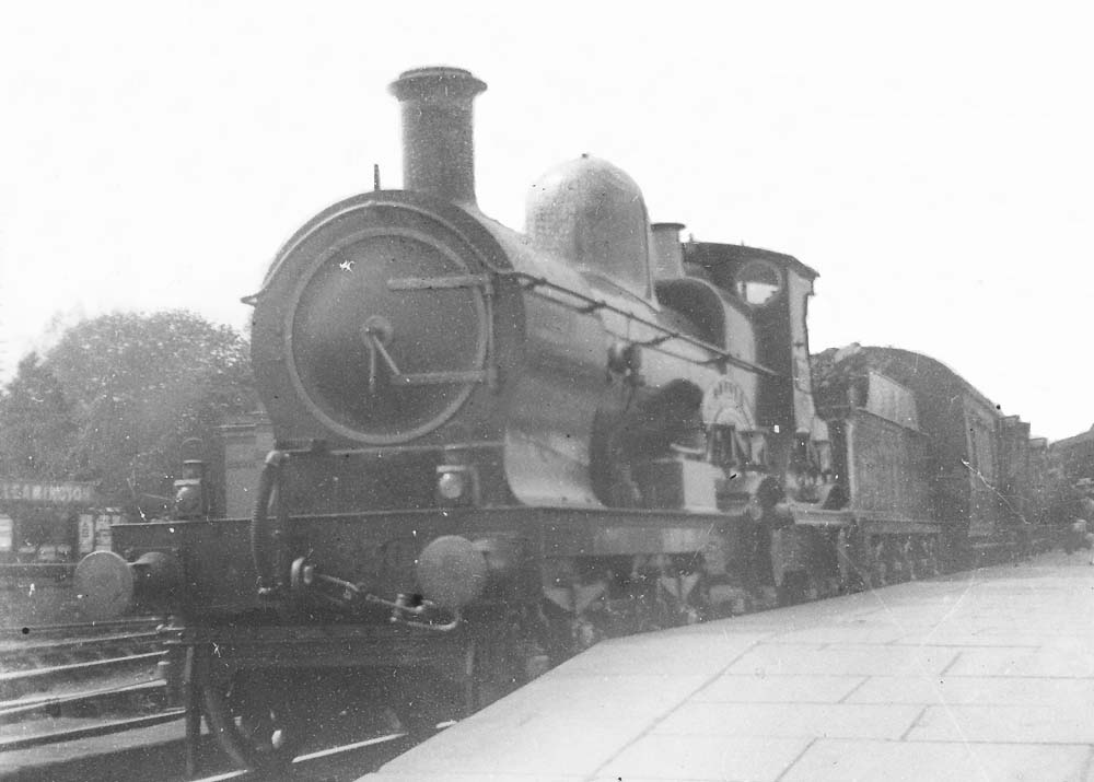 GWR 4-4-0 No 3830 'Armorel' stands at the up platform on a local passenger train to Banbury