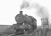 Ex-GWR 4-6-0 68xx Class No 6879 'Overton Grange' is seen running light engine to Leamington shed on 13th March 1965
