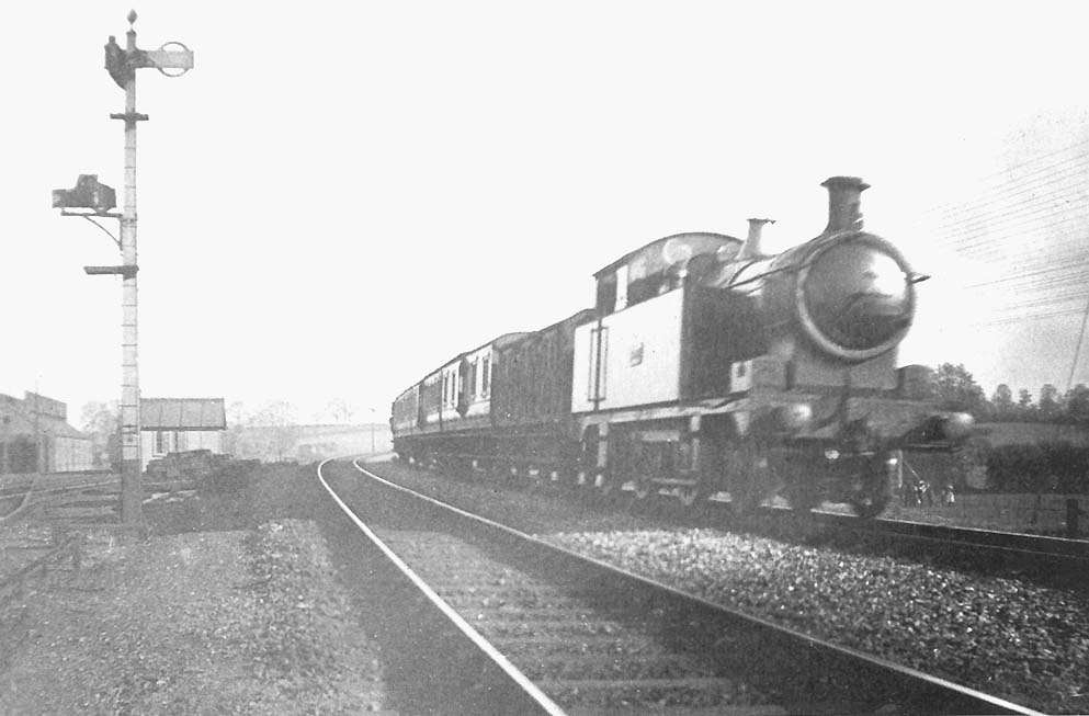 An unknown GWR '36xx' class 2-4-2T coasts past Leamington shed on the approach to the viaducts with a down local passenger train