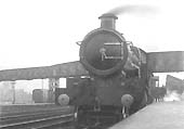 GWR 4-4-0 No 3803 'County Cork', based at Paddington, stands at the down platform at the head of a express