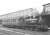 An unidentified GWR 0-6-0PT 54xx class auto tank stands at the head of a one coach auto train enroute to Banbury