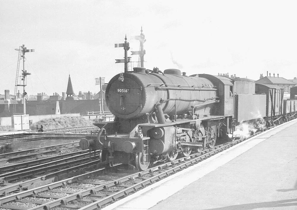 Ex-WD 2-8-0 Austerity No 90516 runs through the down through road at the head of a mixed goods train