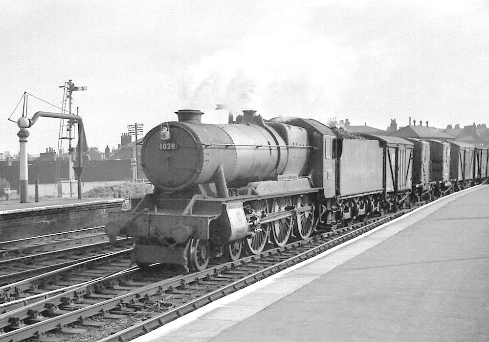 Ex-GWR 4-6-0 County class No 1028 'County of Warwick' passes through Leamington near the town of its name, on a down freight